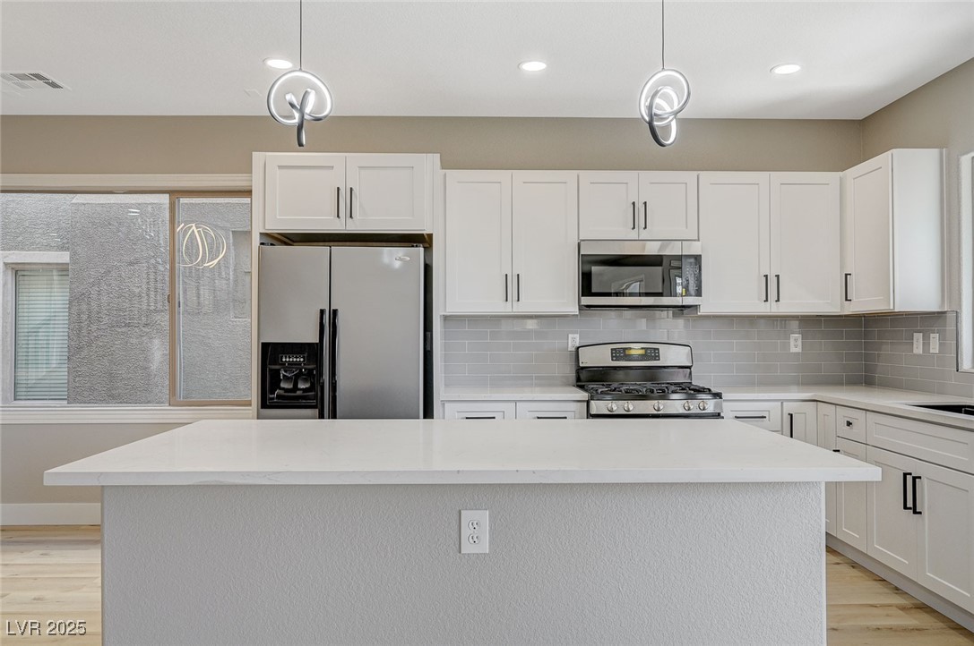 153 Tall Ruff Drive Las Vegas, NV 89148 - Photo 15 of 59 Kitchen featuring light wood-style flooring, appli