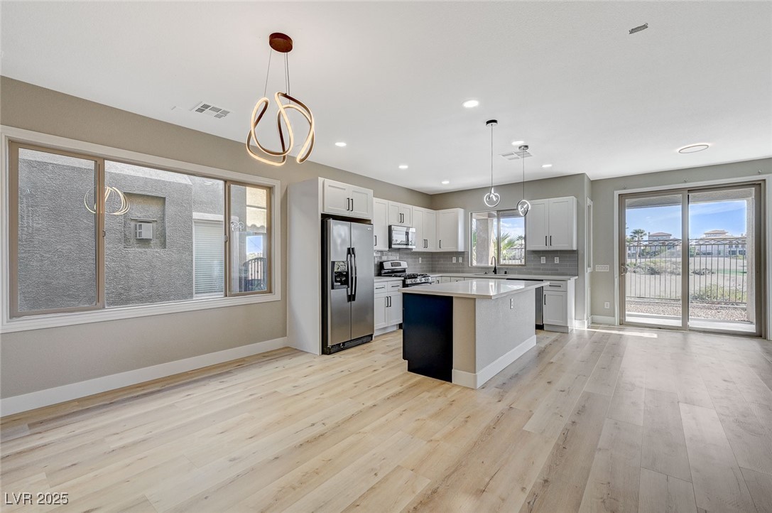 153 Tall Ruff Drive Las Vegas, NV 89148 - Photo 16 of 59 Kitchen with light wood-type flooring, decorative
