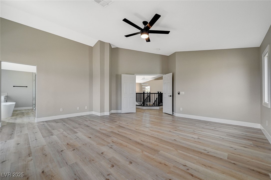 153 Tall Ruff Drive Las Vegas, NV 89148 - Photo 21 of 59 Unfurnished living room featuring a ceiling fan, l