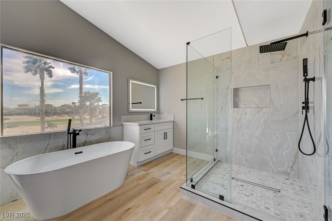 153 Tall Ruff Drive Las Vegas, NV 89148 - Photo 23 of 59 Full bathroom featuring a soaking tub, vanity, til
