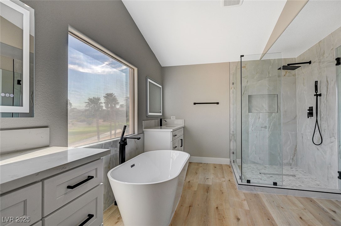 153 Tall Ruff Drive Las Vegas, NV 89148 - Photo 24 of 59 Full bath with vanity, a freestanding tub, a marbl