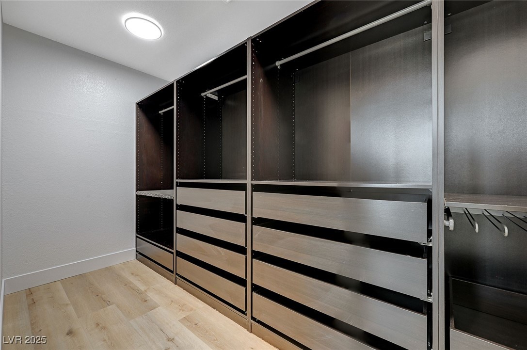 153 Tall Ruff Drive Las Vegas, NV 89148 - Photo 26 of 59 Walk in closet featuring wood finished floors