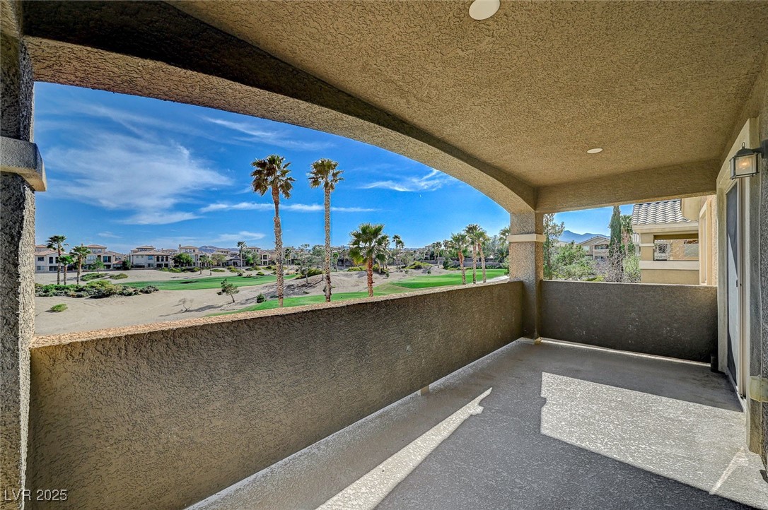 153 Tall Ruff Drive Las Vegas, NV 89148 - Photo 28 of 59 View of patio featuring a balcony and a residentia