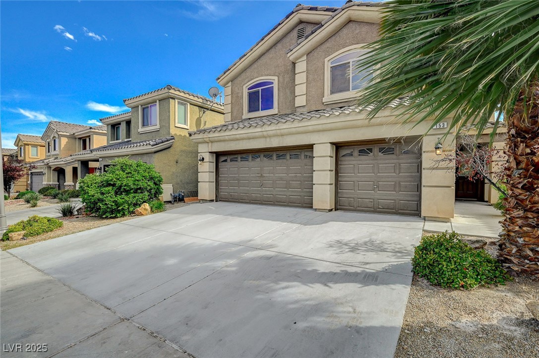 153 Tall Ruff Drive Las Vegas, NV 89148 - Photo 3 of 59 View of front of house with stucco siding, a tile