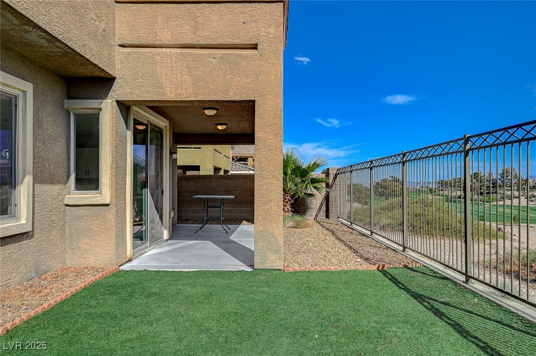 153 Tall Ruff Drive Las Vegas, NV 89148 - Photo 31 of 59 View of yard with a patio and a fenced backyard