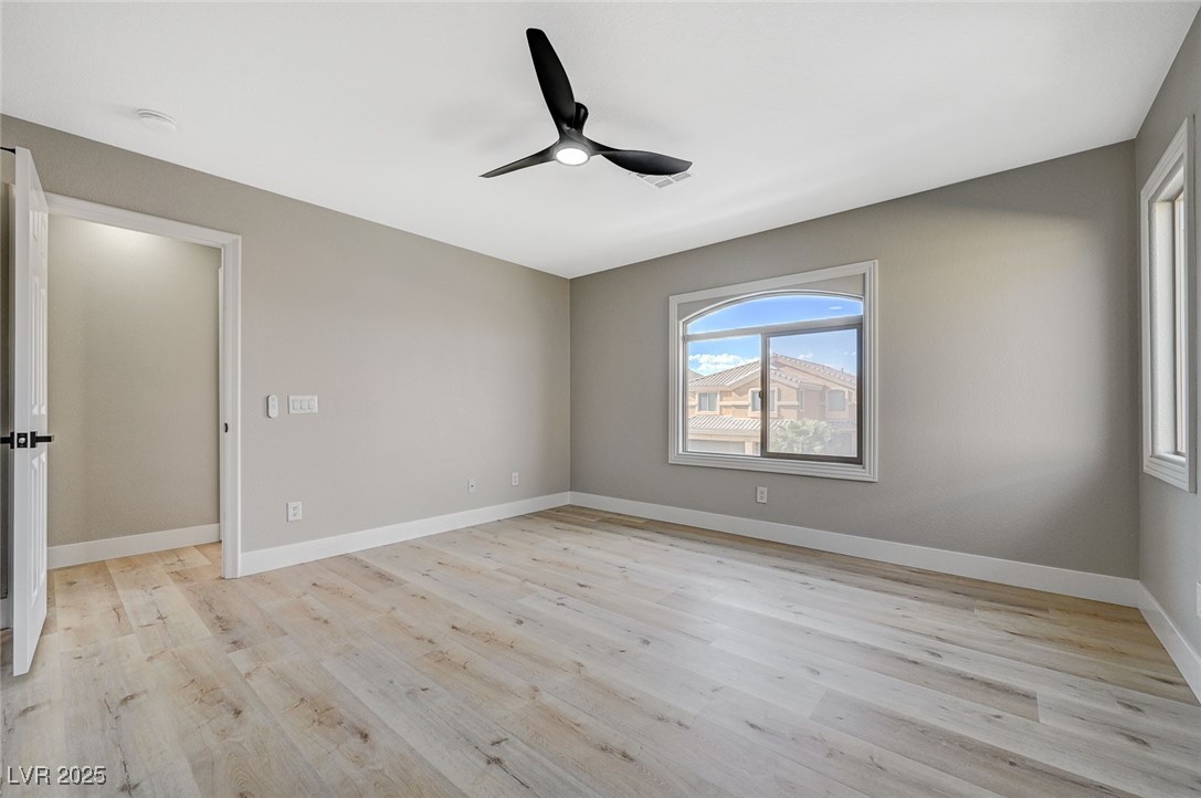 153 Tall Ruff Drive Las Vegas, NV 89148 - Photo 36 of 59 Spare room with baseboards, ceiling fan, and light