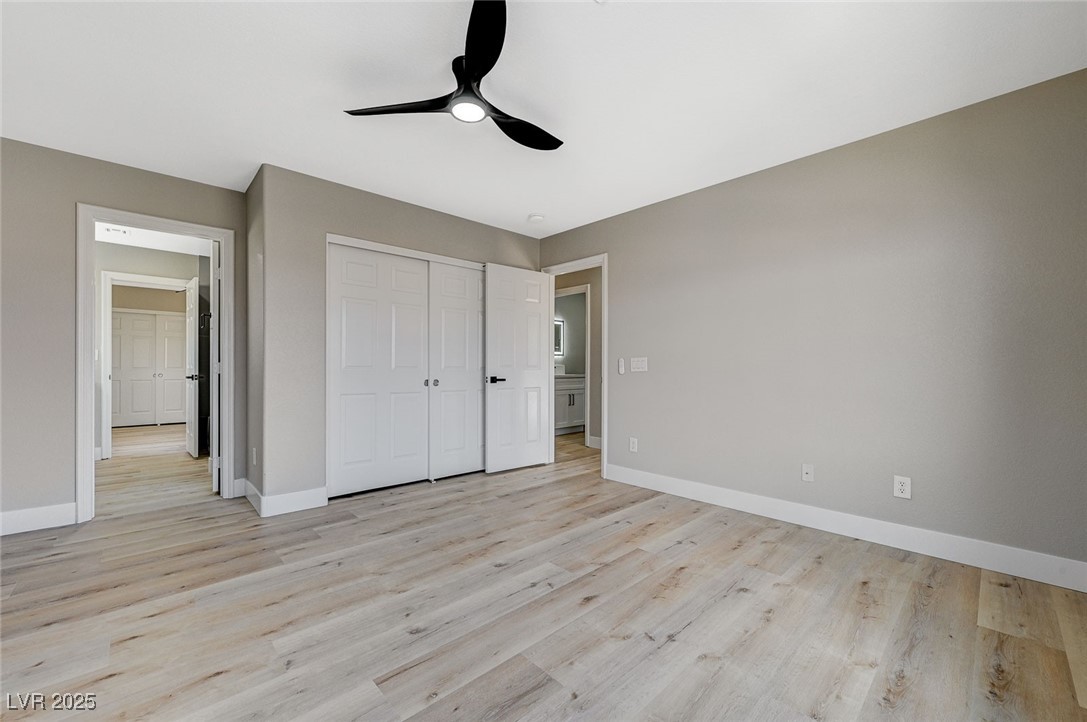 153 Tall Ruff Drive Las Vegas, NV 89148 - Photo 37 of 59 Unfurnished bedroom featuring a closet, baseboards