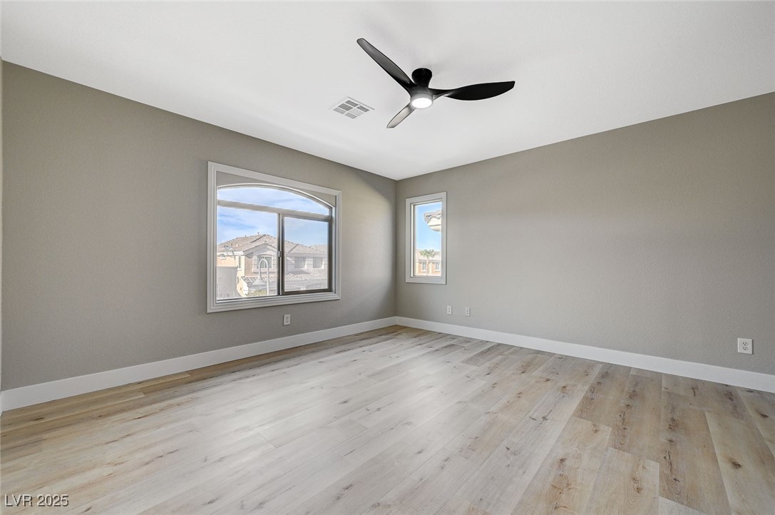 153 Tall Ruff Drive Las Vegas, NV 89148 - Photo 38 of 59 Spare room featuring baseboards, a ceiling fan, an