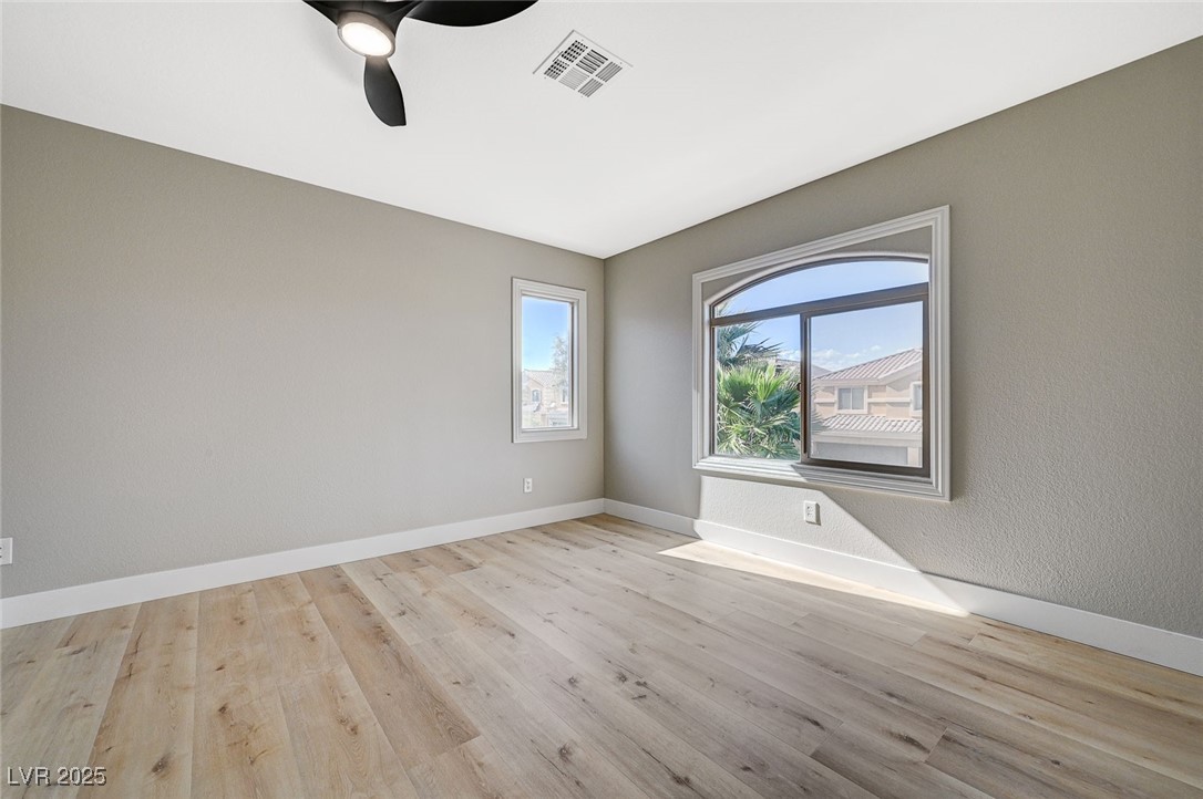 153 Tall Ruff Drive Las Vegas, NV 89148 - Photo 39 of 59 Empty room with baseboards, ceiling fan, visible v