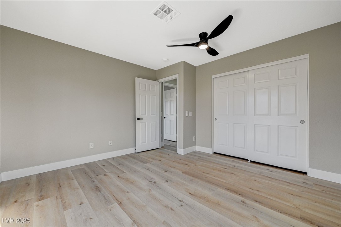 153 Tall Ruff Drive Las Vegas, NV 89148 - Photo 40 of 59 Unfurnished bedroom featuring light wood-style flo