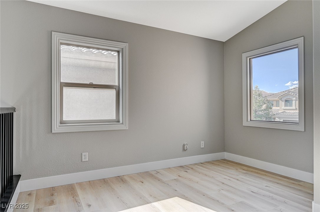 153 Tall Ruff Drive Las Vegas, NV 89148 - Photo 42 of 59 Empty room with baseboards, wood finished floors,