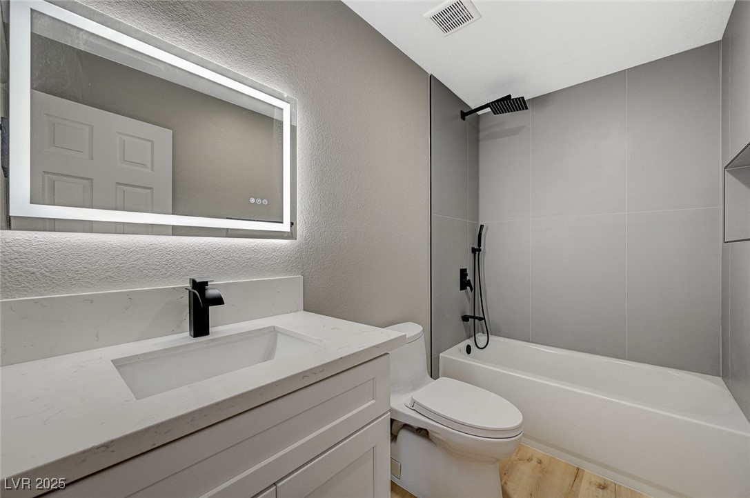 153 Tall Ruff Drive Las Vegas, NV 89148 - Photo 43 of 59 Full bathroom with visible vents, toilet, vanity,