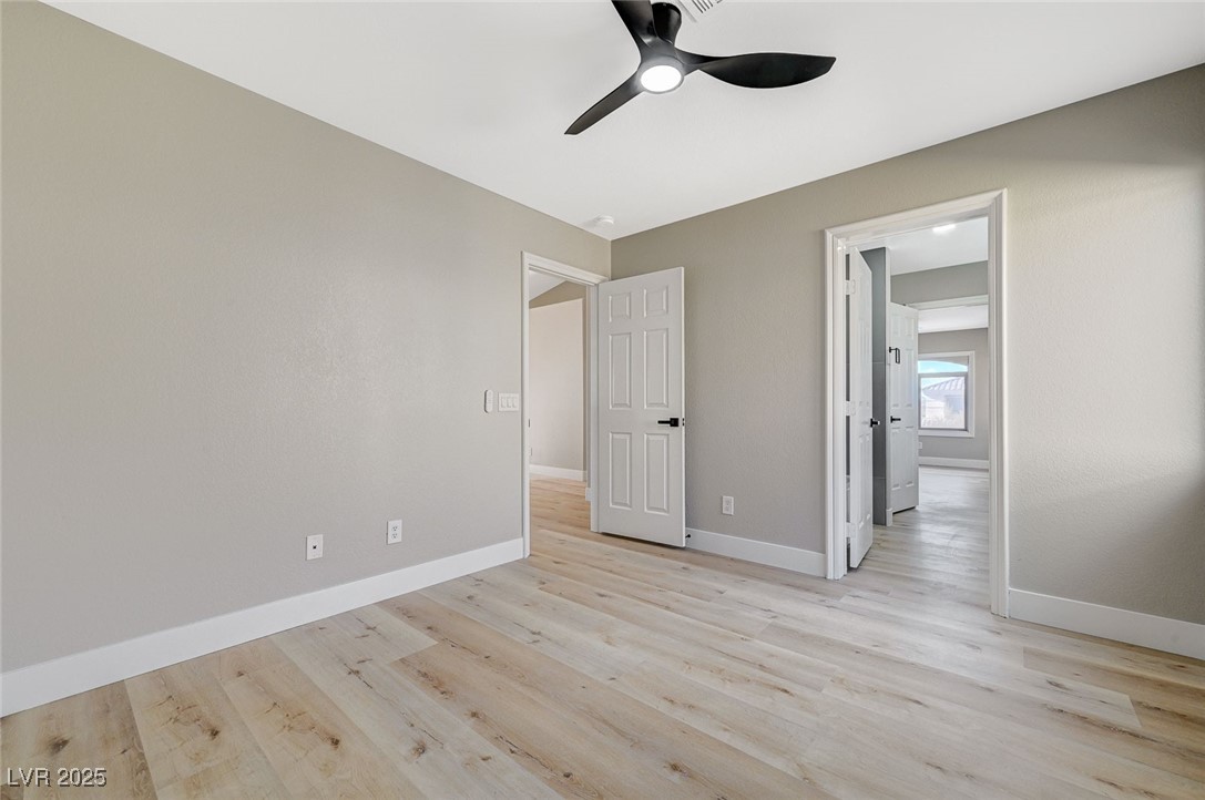 153 Tall Ruff Drive Las Vegas, NV 89148 - Photo 49 of 59 Unfurnished bedroom featuring light wood-style flo