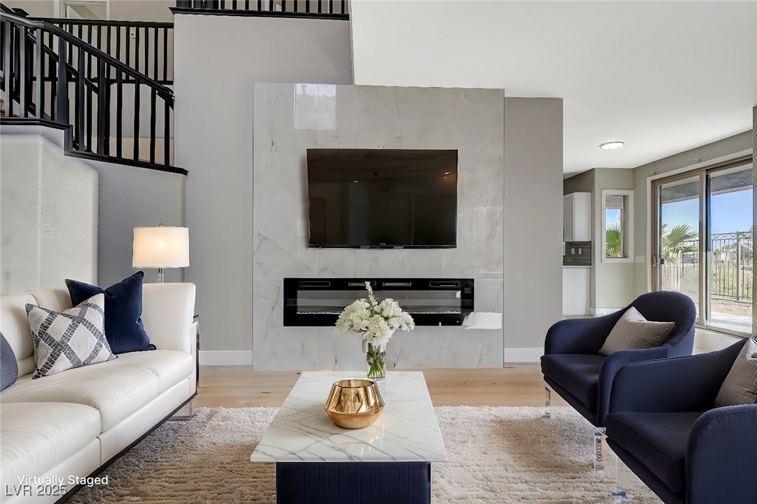 153 Tall Ruff Drive Las Vegas, NV 89148 - Photo 5 of 59 Living room with baseboards, a fireplace, and wood