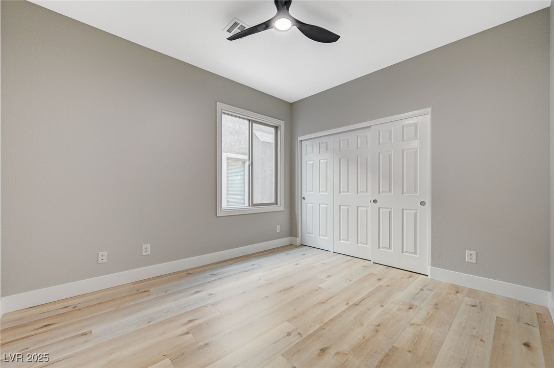 153 Tall Ruff Drive Las Vegas, NV 89148 - Photo 52 of 59 Unfurnished bedroom with light wood-type flooring,