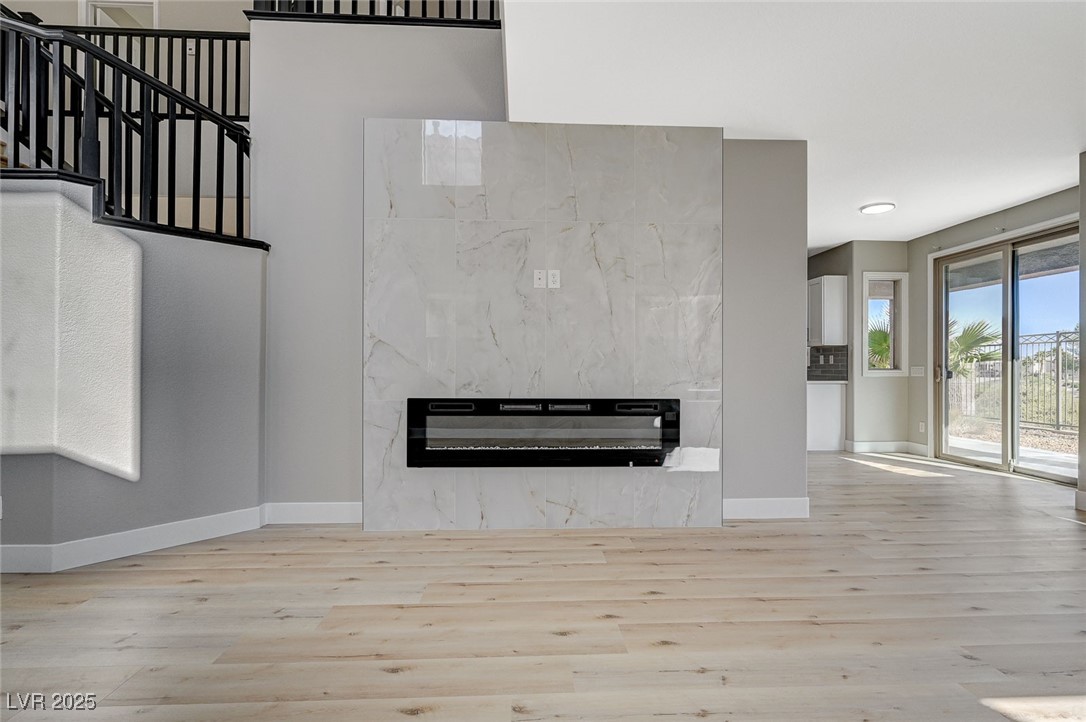 153 Tall Ruff Drive Las Vegas, NV 89148 - Photo 8 of 59 Unfurnished living room with baseboards, a premium