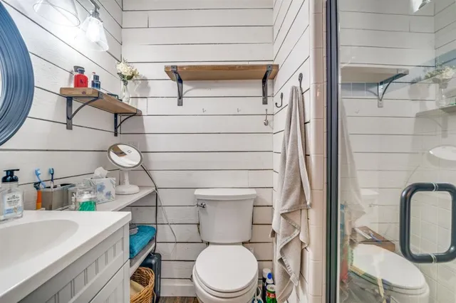 a bedroom with furniture and a wooden floor