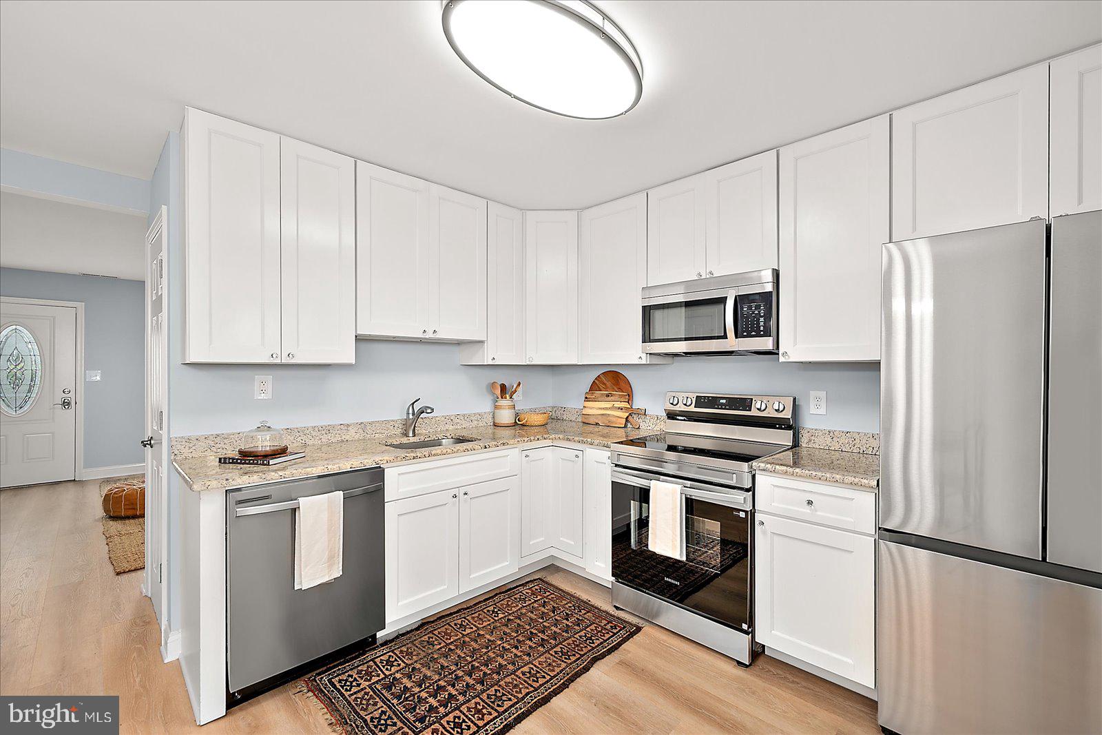 135 Jamestown Road, Unit 18A Ocean City, MD 21842 - Photo 19 of 63 a kitchen with cabinets stainless steel appliances and a counter space