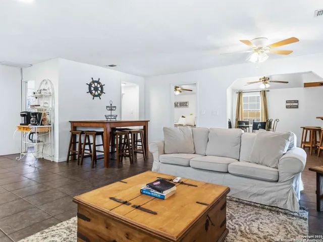 a dining room with furniture and window