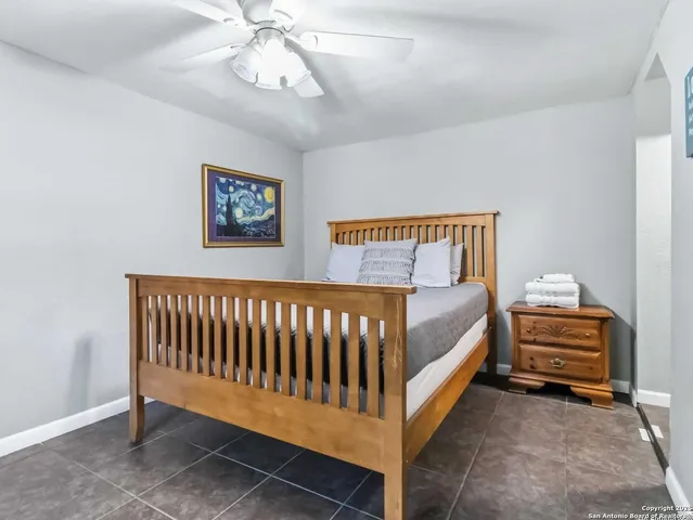 a bedroom with bed and window