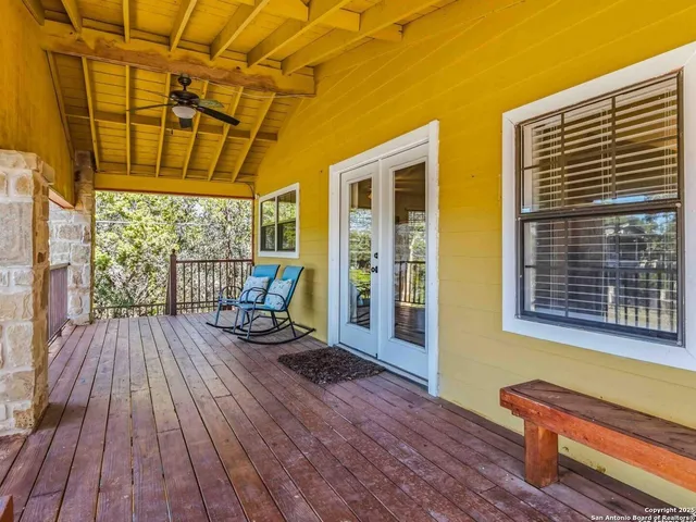 a view of a balcony with wooden floor