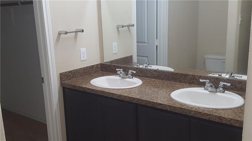 8217 Spotted Doe Drive Fort Worth, TX 76179 - Photo 11 of 22 a sink and a mirror