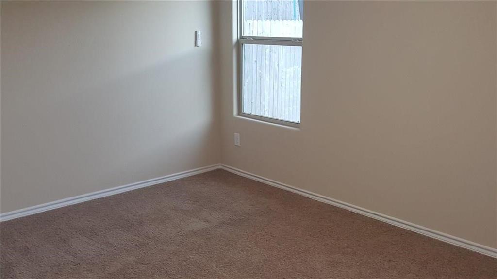 8217 Spotted Doe Drive Fort Worth, TX 76179 - Photo 14 of 22 an empty room with a window