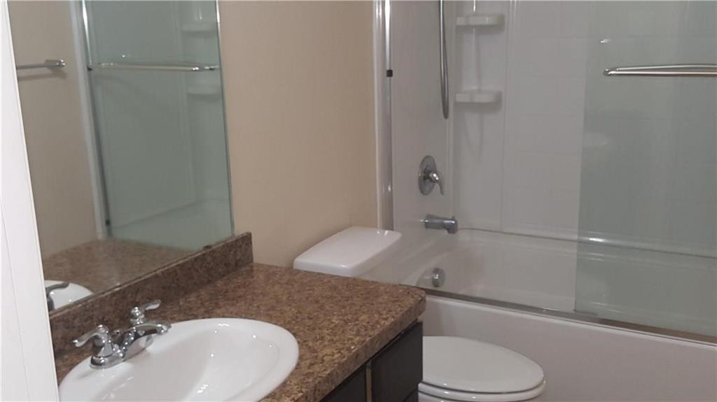 8217 Spotted Doe Drive Fort Worth, TX 76179 - Photo 16 of 22 a bathroom with a granite countertop sink toilet and shower