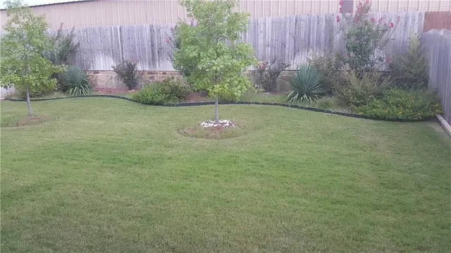 a backyard of a house with lots of green space