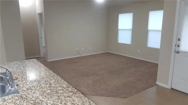 a view of a kitchen cabinets and a stove top oven