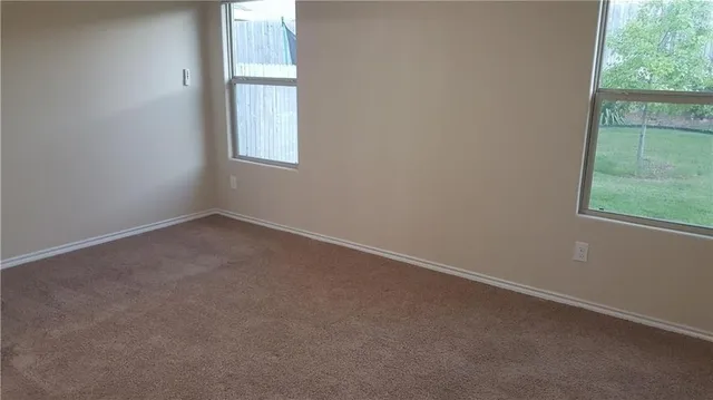 a kitchen with granite countertop a sink and a stove with wooden floor