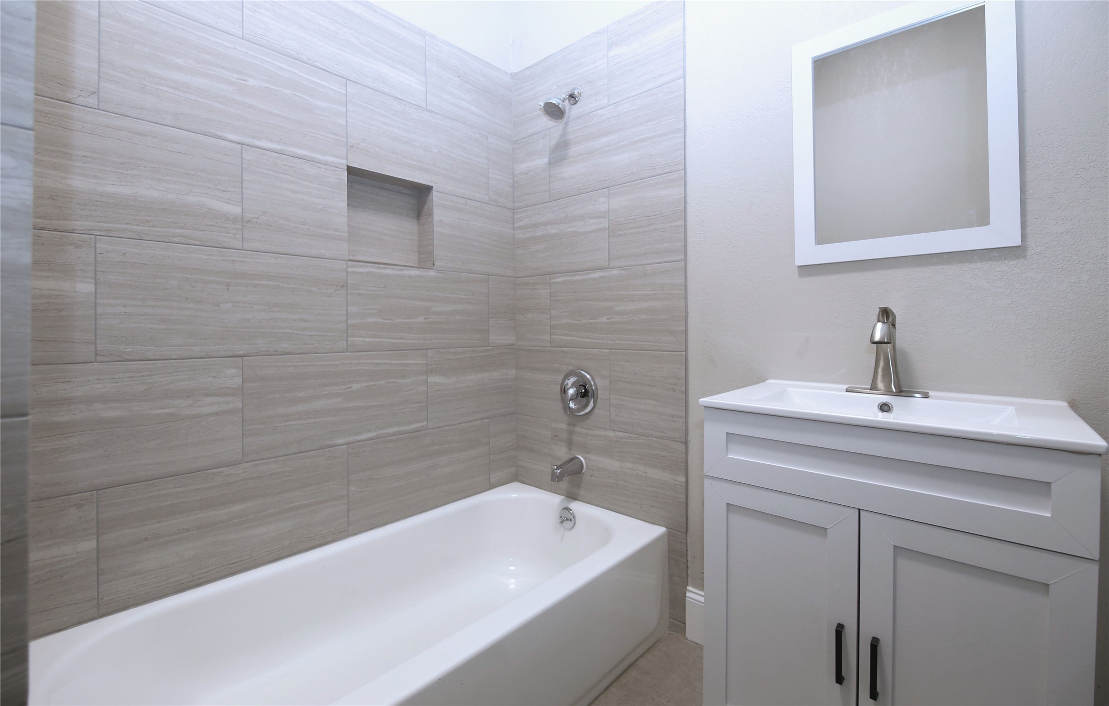 4445 Rusk Street, Unit 2 Houston, TX 77023 - Photo 12 of 21 a bathroom with a sink a toilet and shower