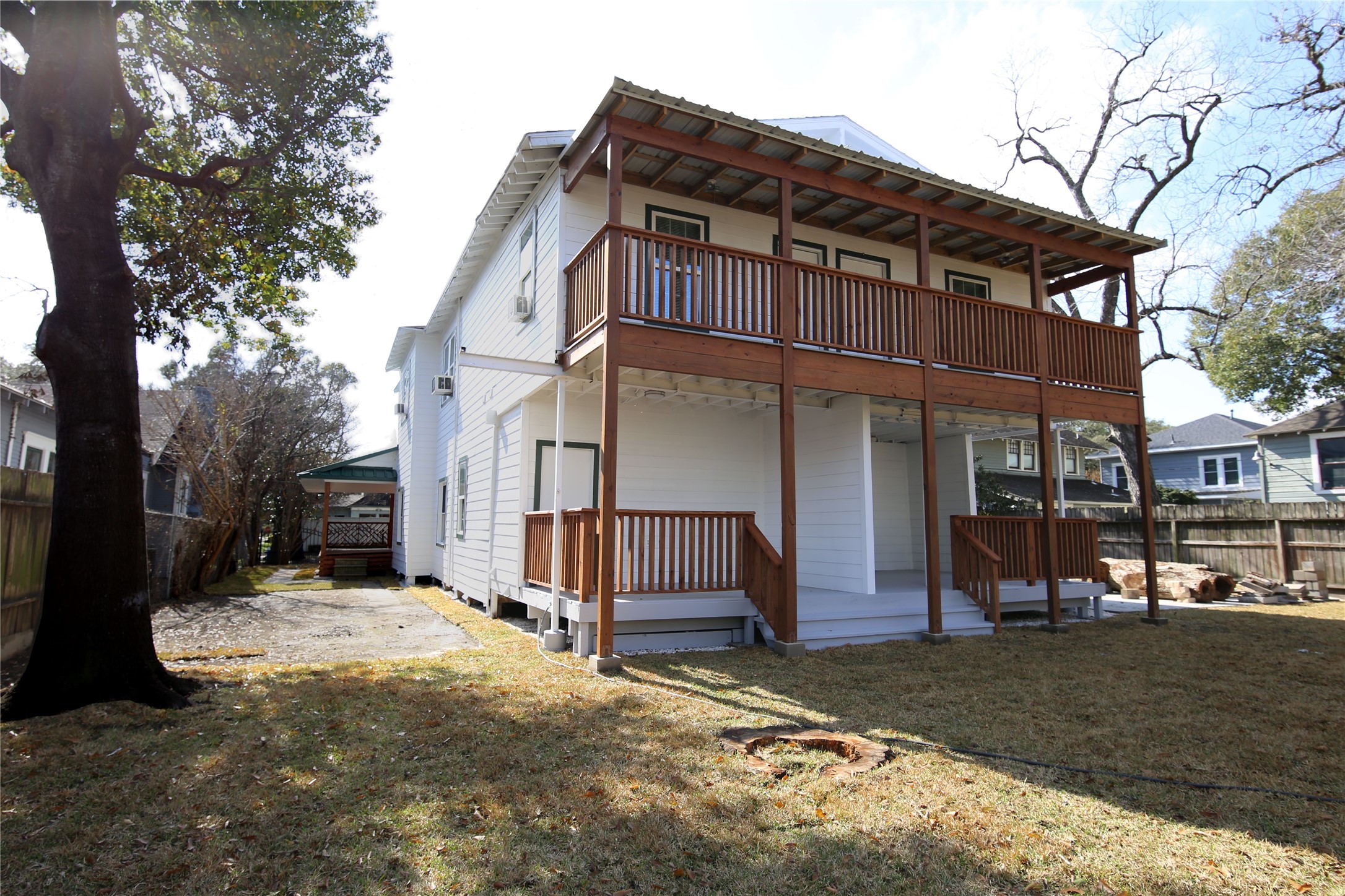 4445 Rusk Street, Unit 2 Houston, TX 77023 - Photo 20 of 21 a view of a house with a yard covered in snow