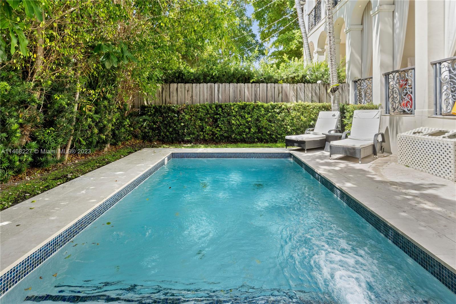 512 Fernwood Road, Unit 2 Key Biscayne, FL 33149 - Photo 12 of 23 a view of a backyard with plants and outdoor seating