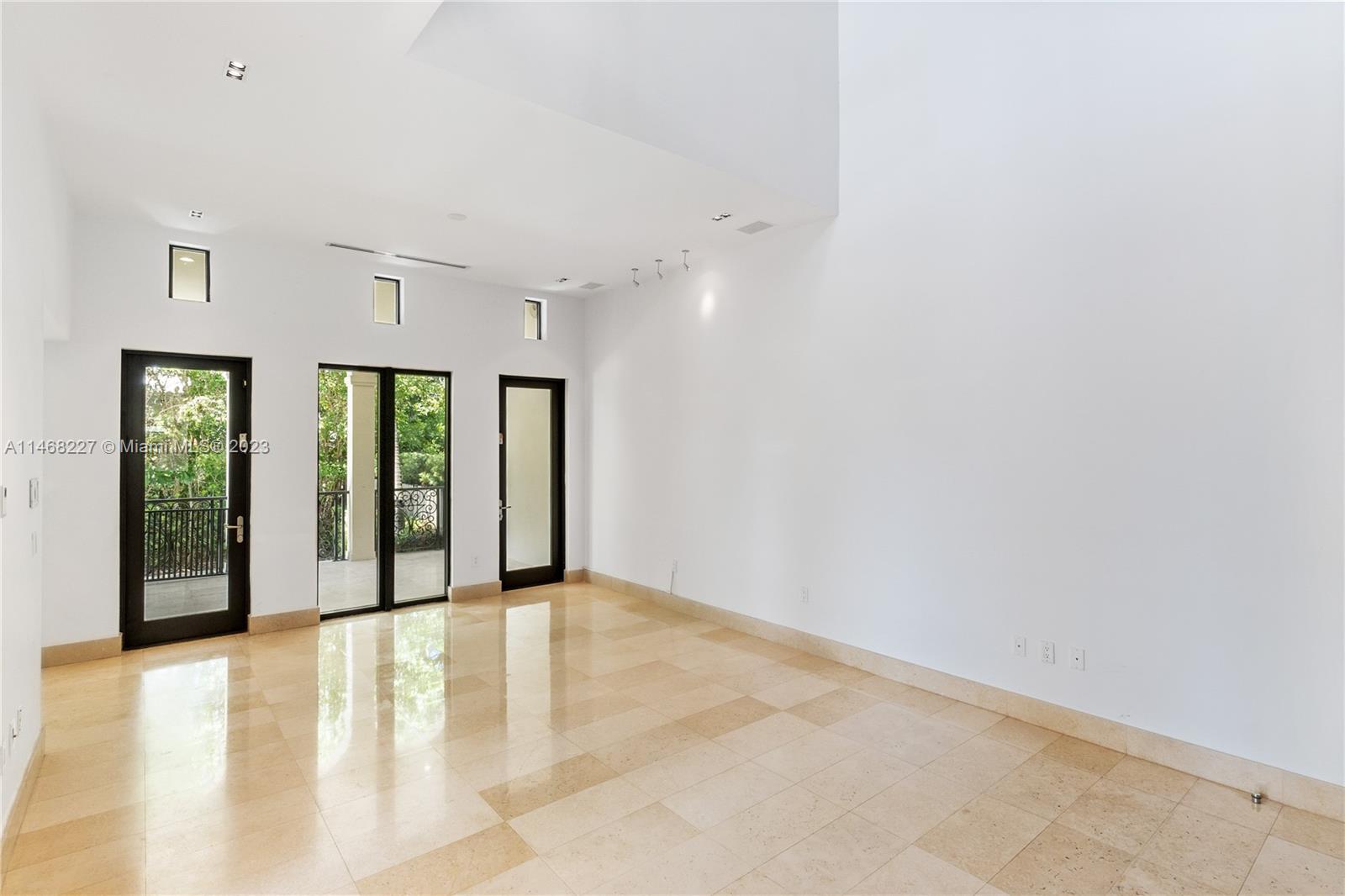 512 Fernwood Road, Unit 2 Key Biscayne, FL 33149 - Photo 13 of 23 a view of an empty room with glass door
