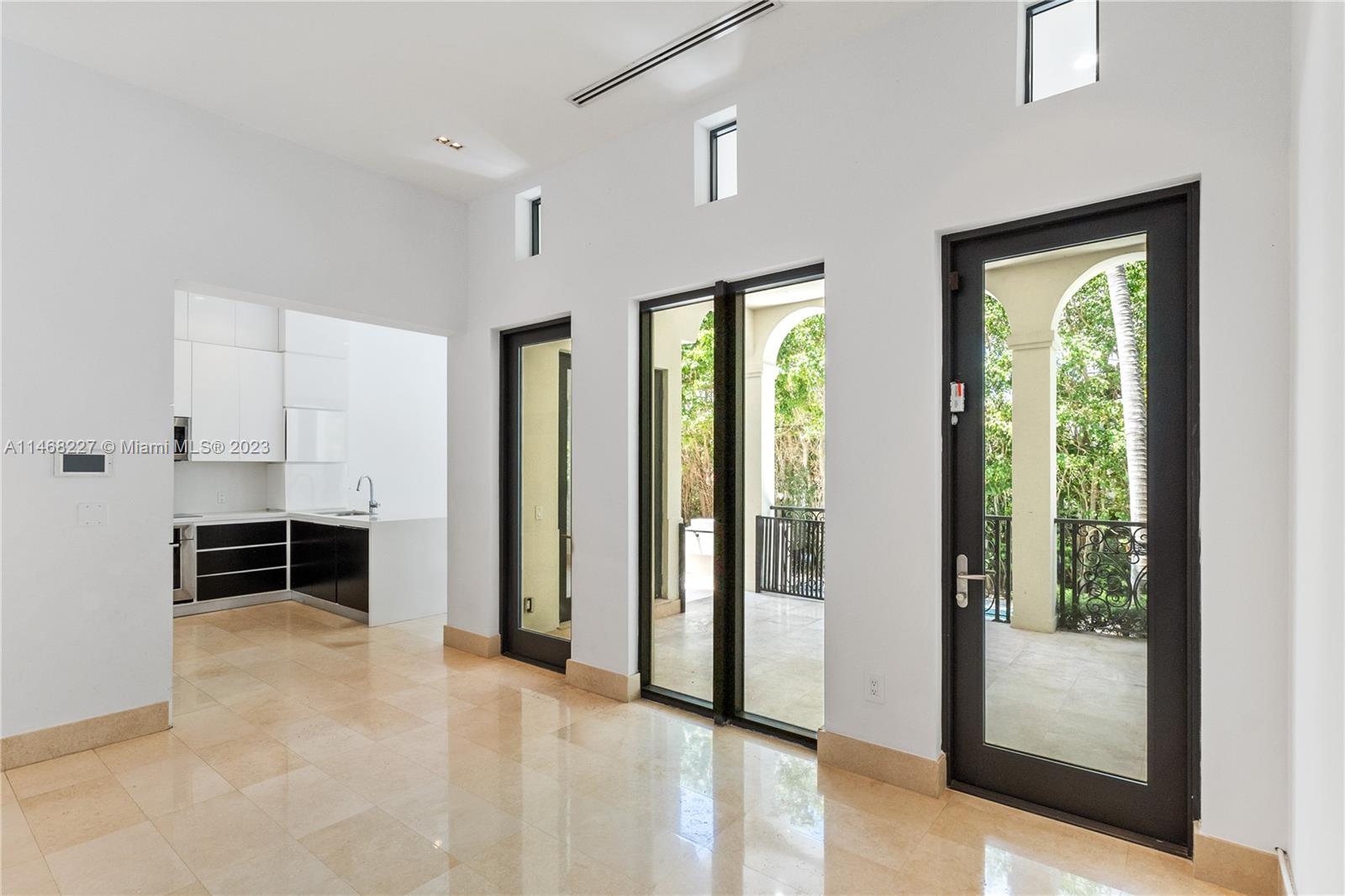 512 Fernwood Road, Unit 2 Key Biscayne, FL 33149 - Photo 16 of 23 a view of livingroom with furniture and windows