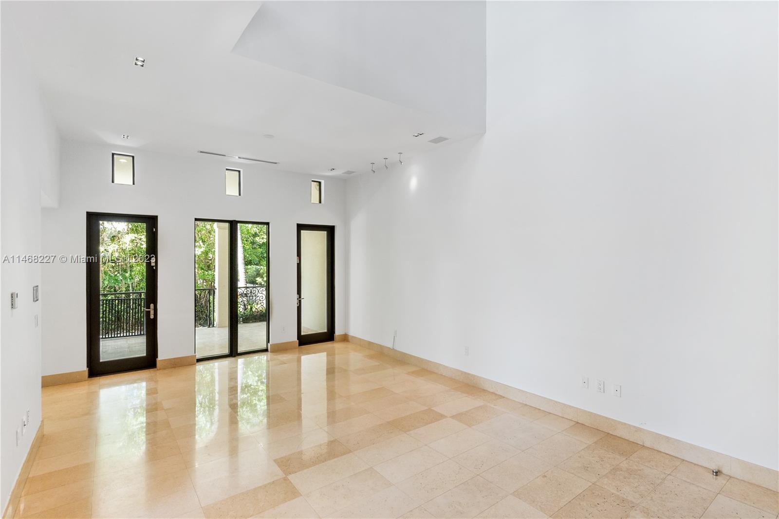 512 Fernwood Road, Unit 2 Key Biscayne, FL 33149 - Photo 18 of 23 a view of an empty room with glass door