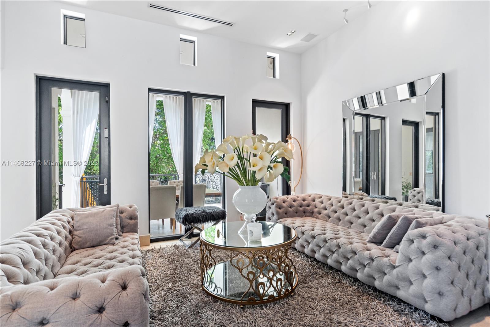 512 Fernwood Road, Unit 2 Key Biscayne, FL 33149 - Photo 4 of 23 a living room with furniture and a large window