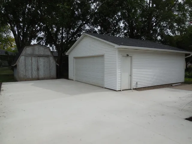 a view of garage and yard
