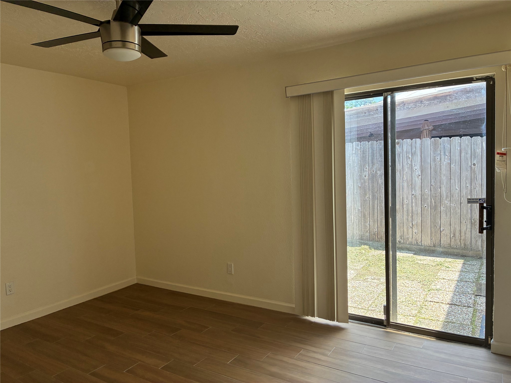 6401 Deihl Road, Unit 1011 Houston, TX 77092 - Photo 12 of 16 a view of an empty room with wooden floor and a window