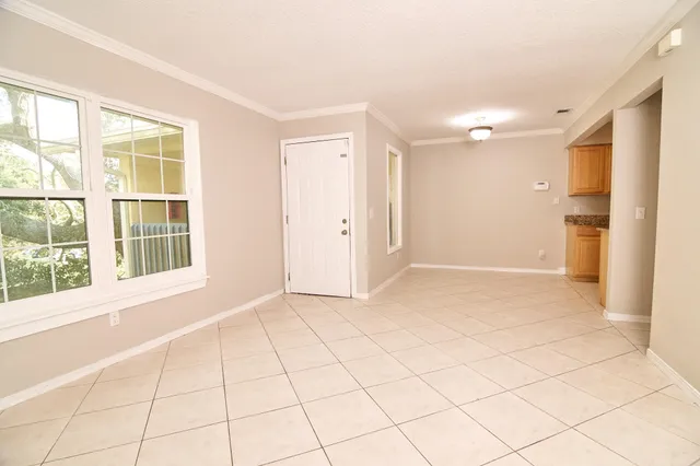 a view of an empty room and window