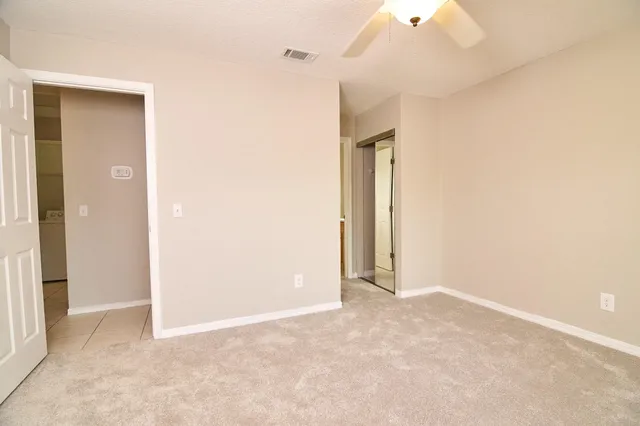 an empty room with a bathroom