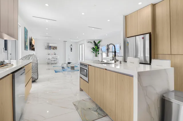 a spacious bathroom with a double vanity sink mirror and shower