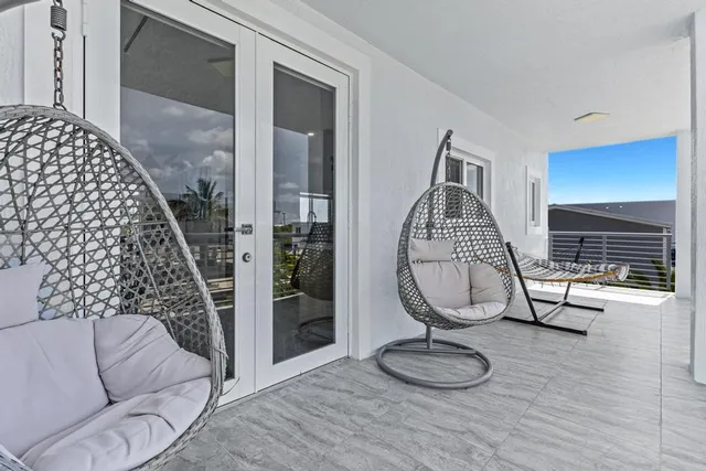 a view of a livingroom with furniture and a window