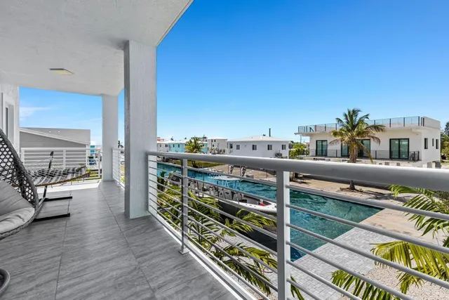a balcony with an outdoor seating