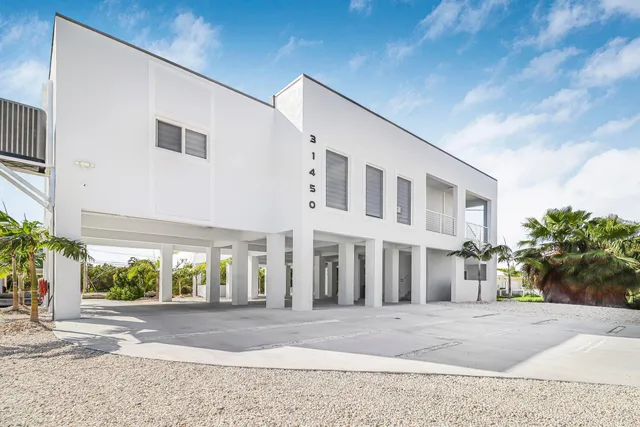 a view of a building with a yard