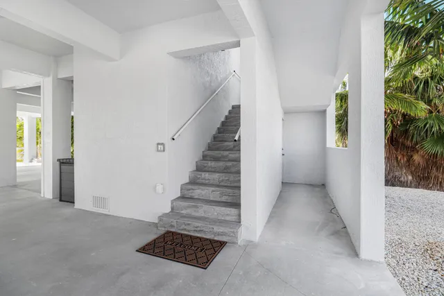 a view of entryway with livingroom and stairs