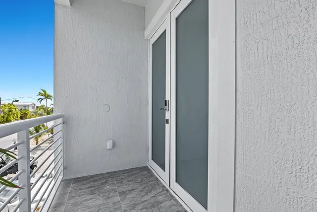 a view of an entryway with wooden floor