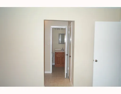 a view of a bathroom from a hallway