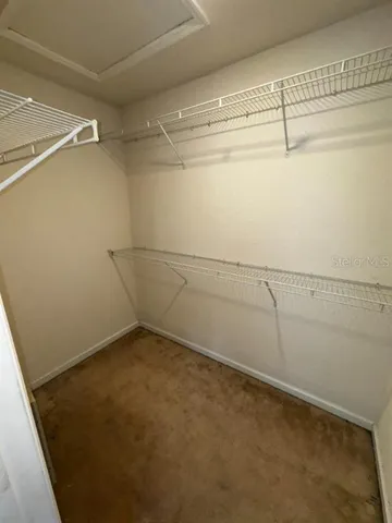 a view of a room with racks on the wall
